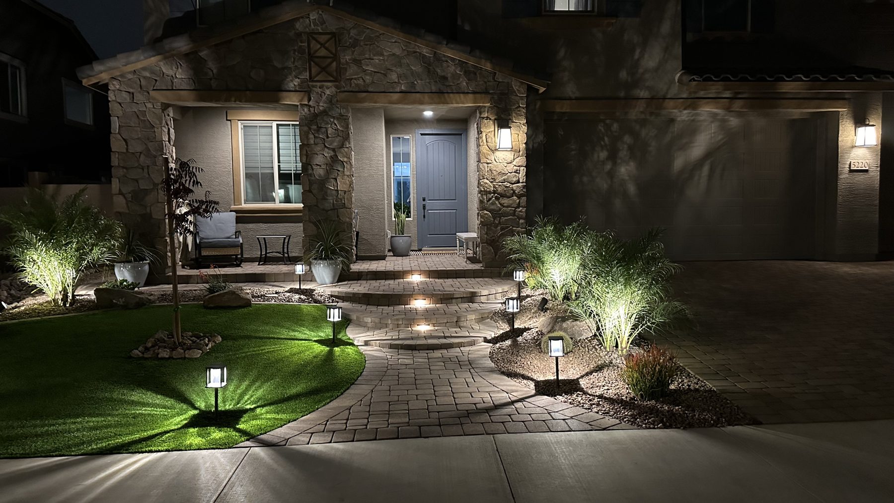 Front yard landscape lighting at night