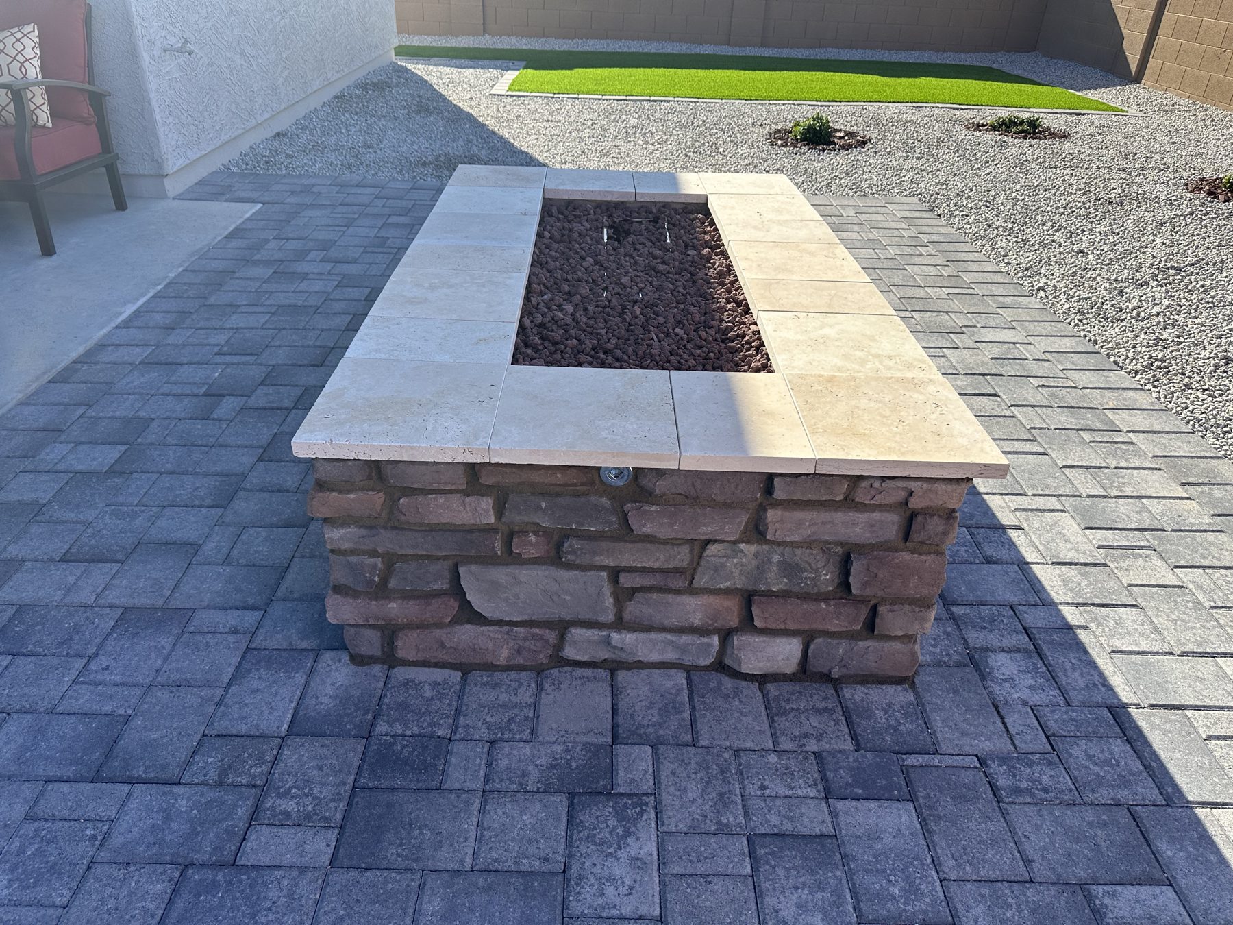 Stone fire pit set on a paver patio